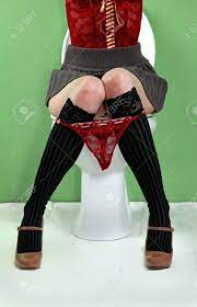 Woman With Red Panties Hanging Around Knees Sitting On Toilet Stock Photo,  Picture And Royalty Free Image. Image 18935754.