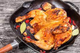 How to marinate whole chicken for grilling. Grilled Whole Chicken Marinated In Honey And Soy Sauce In Grill Pan With Garlic Bay And Pieces Of Chili View From Above Close Up Stock Photo Picture And Royalty Free Image Image 60856265