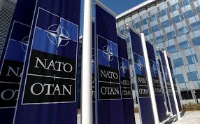 Why is nato spelled backwards at the bottom of the nato logo? Britain Throws Weight Behind Nato As Bulwark Against Russia Reuters