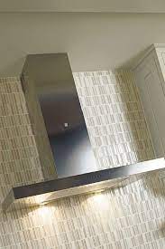 In this kitchen designed by dries otten, the gold mirrored surface brings some. Stainless Steel Range Hood Square Decora