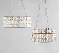 Weighing 30 pounds and measuring 18″ in diameter, 33″ high, with a 6 foot chain for hanging, this chandelier is a manageable dining room table friendly size. Adeline Crystal Round Chandelier Pottery Barn