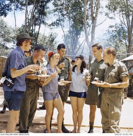 Nui Dat, Vietnam. 1967-10. Performers Patti McGrath (left) and Denise  Drysdale chat with troops ... | Australian War Memorial