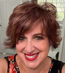 The Gray is graying and the curls popping!! 7 months without shaving my  head and I've cut it twice.