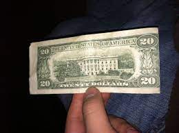If you hold a genuine bill with a denomination of $5 or more up to the light, you will see a security thread running vertically across the bill to the right or left of the portrait. Off Center Back On 20 Dollar Bill Coin Community Forum