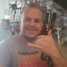 What type of adhesive is used to glue down hydro turf?