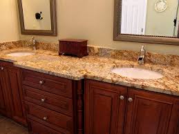 The brown, black and red tones add to the overall design of this bathroom. Bahtroom Vanity Bath Counter Top Bathroom Granite Countertops