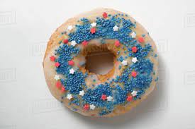Cinnamon sugar with vanilla drizzle. Doughnut With Sprinkles And Stars Red White And Blue Stock Photo Dissolve