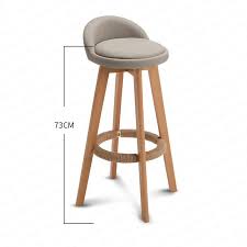 The bar chair sports an invisible wood base plus long and lean tapered legs in a walnut finish with this product has a function: Wooden Nordic Modern Bar Stools Home High Stool Bar Stool Swivel Chair Leisure Back Chair Stool 63 73cm Seat Height Bar Chairs Aliexpress