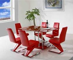 Red chairs bring excitement and playfulness to the room [from: Red Dining Room Chairs Dining Room Furniture Modern Red Dining Room Modern Dining Room Tables