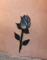 I Got My First Tattoo Today Of A Blue Rose Bud On My Hip Small Rose Tattoo Rose Bud Tattoo Blue Rose Tattoos
