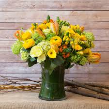 Flowers by philip is a premier florist that handcrafts custom flower bouquets and offers fresh flower delivery in new york, ny Citrus Delight Arrangement By Flowers By Philip