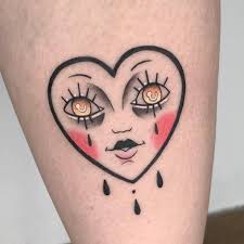 The teardrop tattoo or tear tattoo is a symbolic tattoo of a tear that is placed underneath the eye. Crying Heart Tattoos Cuz Heartbreak Friggin Hurts Traditional Heart Tattoos Bow Tattoo Designs Heart Tattoo Designs