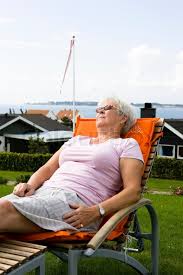 An Elderly Woman Sunbathing On Her Stock Image Colourbox