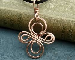 We Swirled Twisted And Hammered 16 Gauge Copper Into This Celtic Knot Influenced Wire Cross Design The Pendant Diy Wire Jewelry Wire Earrings Copper Jewelry