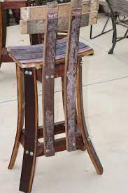 Line the kitchen counter with these solid wood bar stools that take a barrel shape and bring it to life. High Back Bar Stool Up Cycled Fait De Bois De Barils De Vin Etsy Wine Barrel Furniture Barrel Furniture Whiskey Barrel Furniture