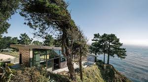 Walls of windows flood the home with natural light. Five Contemporary Cliff Top Houses Architectural Digest