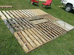 Pallet Patio Part 2 Squaring It Up And Getting It Level I Used Piece Of Scrap 1x4 And 2x4 To Level The Base Well Pallet Patio Pallet Patio Decks Backyard