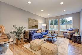 The darker grey accents in the area rug, pillows, hanging lights, lampshades, and swivel armchairs bring contrast and character to this simple design. 80 Beige Living Room Ideas Photos Home Stratosphere