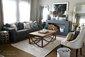 Furnishings include a sofa set and a pair of armchairs with a coffee table. 12 Shapely Living Room Ideas No Fireplace In 2021 Living Room Without Fireplace Focal Point Living Room Living Room With Fireplace