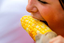 NCAA softball fans enjoy corn eating competition at 2023 WCWS