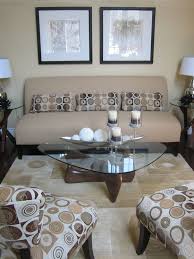 Small Living Room The Light Earth Tones Open The Room And Along With The Glass Table Make It Feel Com Coffe Table Decor Coffee Table Glass Coffee Table Decor