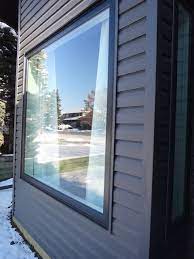 White windows are wonderfully classic, but they sure can look dirty (you can read about my recent window cleaning saga here). Black Exterior Vinyl Window White Interior Black Siding Homestars Brick Exterior House Exterior Siding Exterior Brick