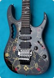 The guitar looks like it was barely played, with protective covering still on the transparent pickguard. Ibanez Ibanez Jem 77 Fp2 N O S 2010 Floral Pattern Tree Of Life Inlay Guitar For Sale Hendrix Guitars