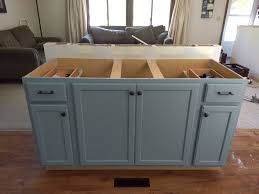 Continue placing cabinets until you have the right number of cabinets that will make up your island. Diy Kitchen Island With Breakfast Bar