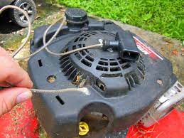Tilt the lawnmower into its sideways to check the blade area. How To Replace A Lawn Mower Starter Cord Home Fixated