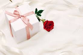 Finally, for wrapped gifts you can find valentine gift wrap in heart designs. Valentine Gift Box Red Ribbon Bow Present With Red Roses On Holiday Stock Photo Picture And Royalty Free Image Image 93936194