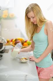 What are mornings like at your home or in your family? Happy Teenager Girl Making Breakfast In Kitchen Stock Photo Picture And Royalty Free Image Image 19712021