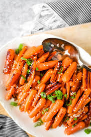 Thinking about giving your kitty some of the extras off your plate? Ginger Honey Roasted Baby Carrots The Gingered Whisk