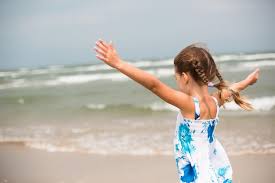 Premium Photo | Portrait of a girl on the seashore the child enjoys the  waves relaxing on the beach traveling