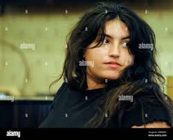 Kathryn Diionno, who is charged with receiving stolen of a Confederate  monument that disappeared earlier this year, looks back before a news  conference in Selma, Ala.,