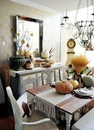 Yellow dining room illuminated by a pendant light that hung over a glass top dining table surrounded with beige skirted chairs. Create Cozy Dining Room With 20 Creative Ideas Herbstdeko Interior Design Ideas Ofdesign