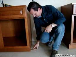 In this case, the countertop was attached to the ends of. How To Level Base Cabinets Using Shims Youtube