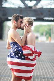 Display this stunning framed american flag in your home or give as a gift to a old rocking chair draped with the american flag looking out on a field of sunflowers. A Young Couple Draped In The American Flag By Chelsea Victoria
