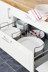 Dish Drawers With Pegs Or Moveable Holders Keep Everything Firmly In Place And Can Be Shifted Kitchen Cabinet Storage Kitchen Organization Diy Kitchen Storage