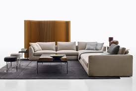 The different modules of the frank sistem with simple shapes and generous proportions, leaning on a thin profile and on nickel varnished or polished supports. Sofa Richard Von B B Italia