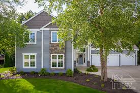 Vinyl siding can be a great choice for siding your home or garage. Vinyl Siding With Stone Veneer Accents Allrite Home Remodeling