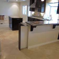 Once i had hammered a line there is linoleum in the kitchen and pergo in the dining room and my sister did not have. Pony Wall With Pocket Door Mediterranean Kitchen Design Pony Wall Dog Gate