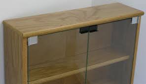 Small media 4 shelf cabinet curved 2 doors 35 espresso cds dvds blurays storage. Dvd Bookcase With Glass Doors In Oak Or Maple By Decibel Designs Decibel Designs