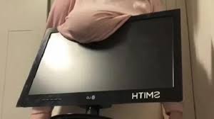 TikTok users hold items with their boobs | The Courier Mail