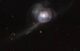 Appearing as a slightly stretched, smaller version of our milky way, the peppered blue and red spiral arms are anchored together by the prominent horizontal Picture Of The Week Esa Hubble