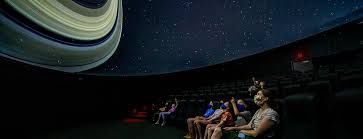 A planetarium (plural planetaria or planetariums) is a theatre built primarily for presenting educational and entertaining shows about astronomy and the night sky, or for training in celestial navigation. Planetarium Showtimes Bell Museum
