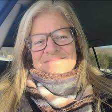 Which hairstyle suits better, curly or straight, for a 60-year-old woman?