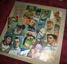 He told me about a project that he had recently done involving baseball cards and furniture. This Baseball Card Table Uses Simple Supplies Mod Podge Rocks