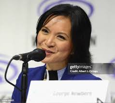 Eric Carrasco and Jim Krieg talk onstage to promote Warner Bros.... News  Photo