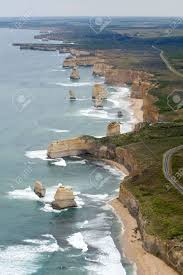 Couple walking past the 12 apostles, great ocean road, victoria, australia discover see the towering 12 apostles, get up close to native wildlife, and take in iconic surf breaks, pristine rainforest and misty waterfalls along the spectacular great ocean road. 12 Apostles On The Great Ocean Road Australia Stock Photo Picture And Royalty Free Image Image 11993631