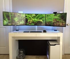 Simple Minimalist White Gaming Computer Desk Setup With Large Triple Monitors And White Nzxt H440 Gaming Computer Desk Computer Desk Setup Computer Desk Design